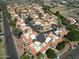 Aerial view showcasing a well-maintained community with red-tiled roofs, mature trees, and manicured landscaping at 10224 N 12Th Pl # 1, Phoenix, AZ 85020