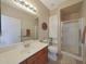 Bathroom with a glass door shower and a cabinet at 10224 N 12Th Pl # 1, Phoenix, AZ 85020