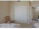 Bedroom with a closet and a chair at 10224 N 12Th Pl # 1, Phoenix, AZ 85020