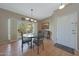 Cozy dining area with a glass table, an outdoor view, and a neutral color palette at 10224 N 12Th Pl # 1, Phoenix, AZ 85020