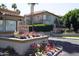 Charming condo building with a tile roof and colorful flower beds in a well-maintained community at 10224 N 12Th Pl # 1, Phoenix, AZ 85020