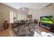 Bright living room with a soaring ceiling, skylight, fireplace, and comfortable seating area at 10224 N 12Th Pl # 1, Phoenix, AZ 85020