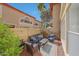 Private patio with cozy seating, potted plants, and string lights, perfect for outdoor relaxation at 10224 N 12Th Pl # 1, Phoenix, AZ 85020