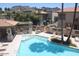 Community pool with several lounge chairs and views of the townhouses at 10224 N 12Th Pl # 1, Phoenix, AZ 85020