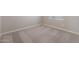 Bedroom showcasing neutral carpeting, base trim, freshly painted walls, and window with blinds at 10281 N 115Th Ave, Youngtown, AZ 85363