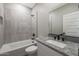 Bathroom with bathtub and shower features granite counters and neutral wall paint at 10353 N 115Th Ave, Youngtown, AZ 85363