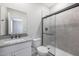 Modern bathroom features an updated vanity and a walk-in shower with glass doors at 10353 N 115Th Ave, Youngtown, AZ 85363