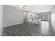 Open living space featuring gray floors, modern lighting, a ceiling fan, and a modern kitchen at 10353 N 115Th Ave, Youngtown, AZ 85363