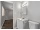 Bathroom featuring a white vanity with an open doorway leading to an adjacent room at 12211 N 25Th Ave, Phoenix, AZ 85029
