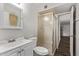 Bathroom with a glass-enclosed shower, vanity sink, and a tiled floor at 12211 N 25Th Ave, Phoenix, AZ 85029