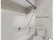 Bathroom featuring a white tiled bathtub and a toilet at 12211 N 25Th Ave, Phoenix, AZ 85029