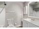 Bathroom featuring a white vanity and a toilet with tiled walls at 12211 N 25Th Ave, Phoenix, AZ 85029