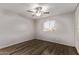 Bedroom features include wood-look flooring, a ceiling fan, and a window with bright light at 12211 N 25Th Ave, Phoenix, AZ 85029