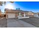 Charming single-story home with a brick accent and a well-lit facade at 12211 N 25Th Ave, Phoenix, AZ 85029