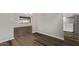 Open-concept living space featuring modern wood flooring, neutral paint, and natural light at 12211 N 25Th Ave, Phoenix, AZ 85029