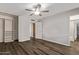 Spacious main bedroom featuring hardwood floors, walk-in closet, and ensuite bathroom at 12211 N 25Th Ave, Phoenix, AZ 85029