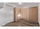 Interior room with wood-look flooring and built-in cabinets for ample storage at 12211 N 25Th Ave, Phoenix, AZ 85029