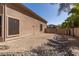 Gravel-filled backyard with adjacent home, rock features, privacy fence, and palm trees at 12442 N Via La Playa --, Fountain Hills, AZ 85268