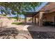 Wide view of backyard with covered patio, low-maintenance desert landscaping, and synthetic grass at 12442 N Via La Playa --, Fountain Hills, AZ 85268