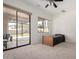 Bright bedroom with a ceiling fan, a large window, and sliding glass doors to the outdoor living space at 12442 N Via La Playa --, Fountain Hills, AZ 85268