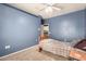 Bedroom featuring blue walls, neutral carpet, and a ceiling fan for added comfort at 12442 N Via La Playa --, Fountain Hills, AZ 85268