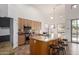 Well-lit kitchen featuring a kitchen island with barstool seating, stainless steel appliances, and granite countertops at 12442 N Via La Playa --, Fountain Hills, AZ 85268