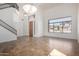 Bright living room featuring high ceilings, staircase, and a large window with neighborhood views at 12442 N Via La Playa --, Fountain Hills, AZ 85268