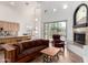 Comfortable living room featuring a fireplace, an open concept design, and lots of natural light at 12442 N Via La Playa --, Fountain Hills, AZ 85268