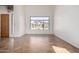 Bright and spacious living room featuring tile flooring and a large window with views of the front yard at 12442 N Via La Playa --, Fountain Hills, AZ 85268