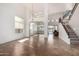 Open living room with staircase and a view of adjacent sitting area with tile floors and natural light at 12442 N Via La Playa --, Fountain Hills, AZ 85268