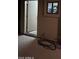 A well-lit doorway to a storage room, partially open, with visible electrical components at 12442 N Via La Playa --, Fountain Hills, AZ 85268