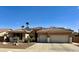 Charming single-story home with a well-maintained yard, desert landscaping, and two-car garage at 1339 N Tucana Ln, Gilbert, AZ 85234