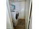 Efficient laundry room with modern washer and dryer, along with storage shelves for a tidy home at 1339 N Tucana Ln, Gilbert, AZ 85234