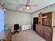 Spacious room with a ceiling fan, and a mix of white and wood furniture providing lots of storage space at 1339 N Tucana Ln, Gilbert, AZ 85234