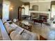 Comfortable living room featuring tile floors, a fireplace, and large windows for natural light at 1339 N Tucana Ln, Gilbert, AZ 85234