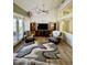 Comfortable living room showcases a contemporary rug, ceiling fan, and sliding door access to outdoor area at 1339 N Tucana Ln, Gilbert, AZ 85234