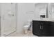 Bathroom featuring a glass shower, toilet, and sleek vanity with modern fixtures at 14194 W Sand Hills Rd, Surprise, AZ 85387