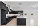 Open kitchen featuring an island, black cabinets, stainless steel appliances, and eat in kitchen at 14194 W Sand Hills Rd, Surprise, AZ 85387