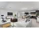 Spacious open-concept living room and dining area with modern furnishings and plenty of natural light at 14194 W Sand Hills Rd, Surprise, AZ 85387