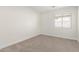 Clean bedroom with carpet flooring and window with blinds at 1588 S 226Th Dr, Buckeye, AZ 85326
