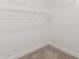 Corner of walk-in closet with carpet flooring and wire shelving at 1588 S 226Th Dr, Buckeye, AZ 85326