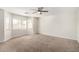 Spacious main bedroom with plush carpeting and large windows for natural light at 1588 S 226Th Dr, Buckeye, AZ 85326