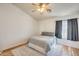 Comfortable bedroom featuring soft gray bedding, modern decor, and a cozy atmosphere with natural light at 1600 N Saba St # 177, Chandler, AZ 85225