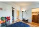 Bright bedroom with wood floors, white walls, and playful decor next to a closet and open doorway at 1600 N Saba St # 177, Chandler, AZ 85225