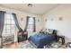 Cozy bedroom with plenty of natural light, a neutral color palette and hardwood floors at 1600 N Saba St # 177, Chandler, AZ 85225