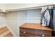 Neat closet with hanging storage, built-in shelves, and a dresser for organized storage at 1600 N Saba St # 177, Chandler, AZ 85225