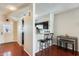 Open dining area leading to a well-lit kitchen with barstool seating at 1600 N Saba St # 177, Chandler, AZ 85225