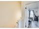 Hallway featuring carpeted steps and a door to a bedroom with natural light at 1600 N Saba St # 177, Chandler, AZ 85225