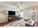 Cozy living room featuring a ceiling fan, desk area and comfortable seating at 1600 N Saba St # 177, Chandler, AZ 85225