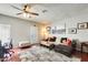 Cozy living room featuring a ceiling fan, a plush rug, and stylish decor at 1600 N Saba St # 177, Chandler, AZ 85225